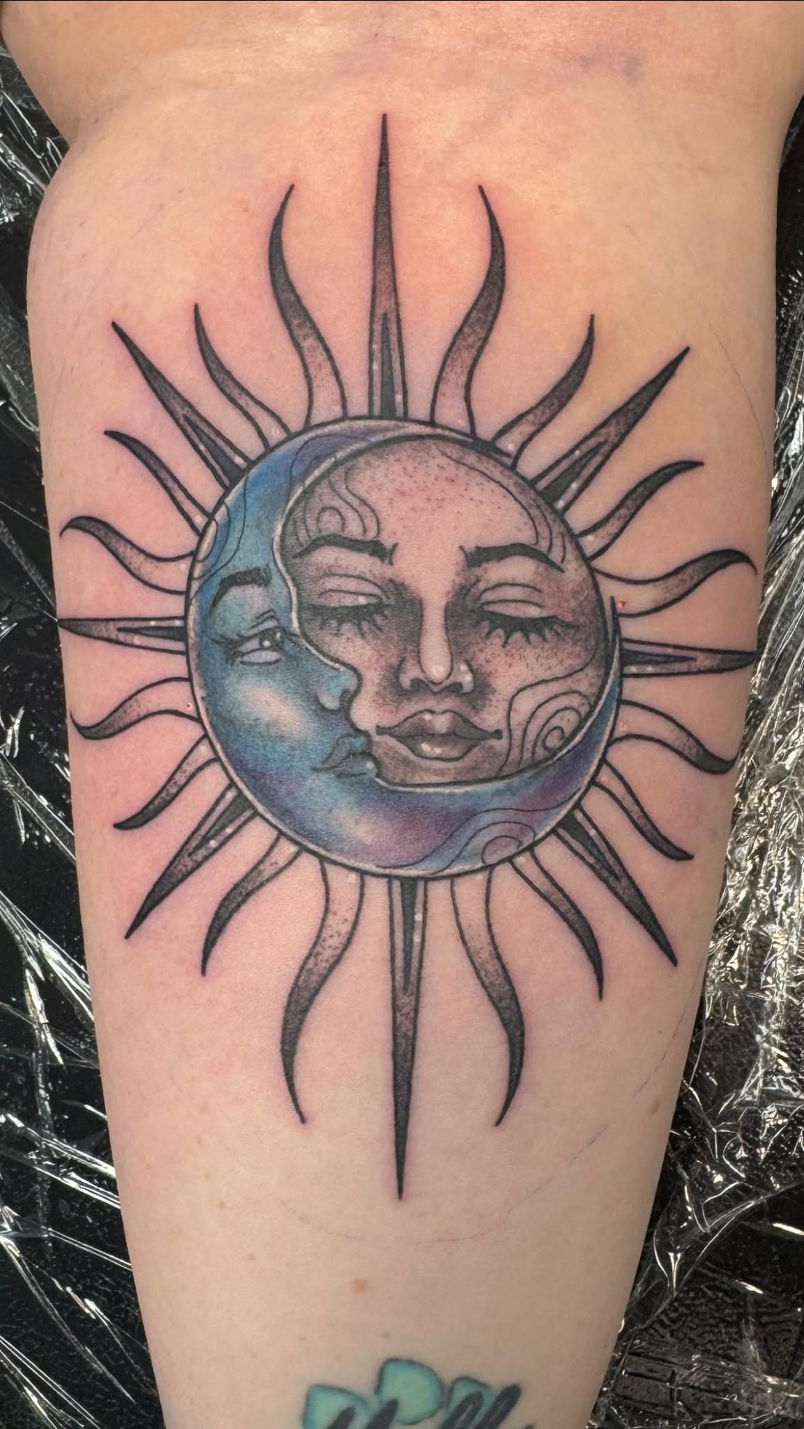 Sun and moon tattoo, forearm